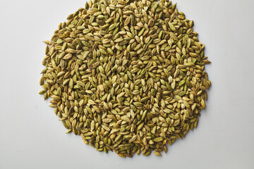 Top view shot of cardamom on white background.