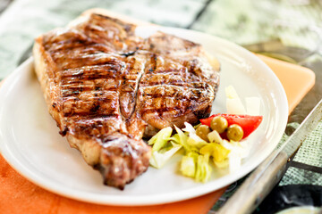 Grilled or barbecued Florentine steak on a plate