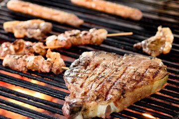 Grilling a beef Florentine steak on a barbecue