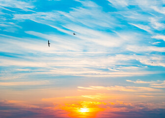 blue sky and white clouds at sunrise