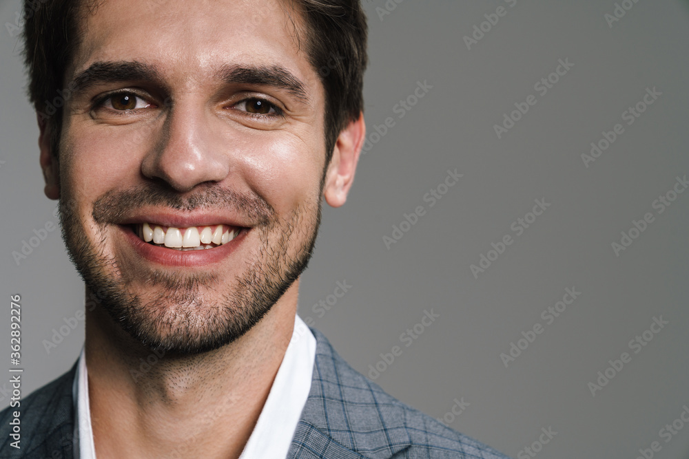 Sticker photo of pleased businessman in jacket posing and smiling at camera