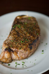 Steak. Grass-fed skirt steak, grilled to a medium rare and served with a garlic herb butter sauce and paired with roasted potatoes and Brussels sprouts. Classic American steakhouse favorite.