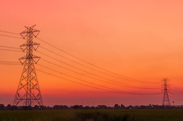 High voltage electric pole in beautiful sweet tone sunrise twilight for background.