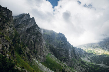 Scenic view of sharp rocky mountain peaks in the dark clouds near the Morskie Oko lake, High Tatras, Zakopane, Poland