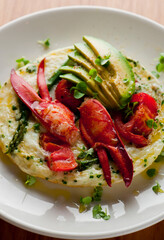 Frittata or omelette lobster avocado. Egg-based Italian dish w/ scrambled eggs, enriched with...