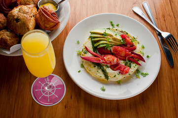 Frittata or omelette lobster avocado. Egg-based Italian dish w/ scrambled eggs, enriched with additional ingredients. classic seafood restaurant brunch/breakfast menu item. Maine lobster frittata. 