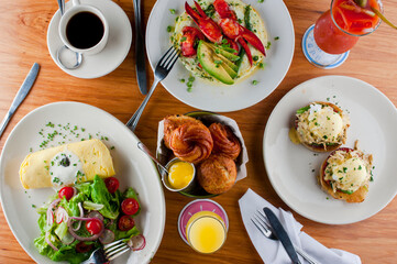 Frittata or omelette lobster avocado. Egg-based Italian dish w/ scrambled eggs, enriched with additional ingredients. classic seafood restaurant brunch/breakfast menu item. Maine lobster frittata. 
