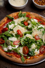 Pizza. Traditional New York City style margarita pizza pie with a thin homemade crispy crust, fresh tomato garlic marinara sauce topped with buffalo mozzarella cheese and fresh basil leaves.