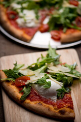 Pizza. Traditional New York City style margarita pizza pie with a thin homemade crispy crust, fresh tomato garlic marinara sauce topped with buffalo mozzarella cheese and fresh basil leaves.