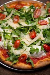 Pizza. Traditional New York City style margarita pizza pie with a thin homemade crispy crust, fresh tomato garlic marinara sauce topped with buffalo mozzarella cheese and fresh basil leaves.