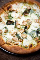 Pizza. Traditional New York City style margarita pizza pie with a thin homemade crispy crust, fresh tomato garlic marinara sauce topped with buffalo mozzarella cheese and fresh basil leaves.