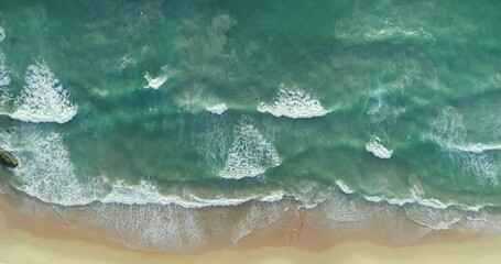 Tropical sea with wave crashing on beach aerial view drone shot Top view