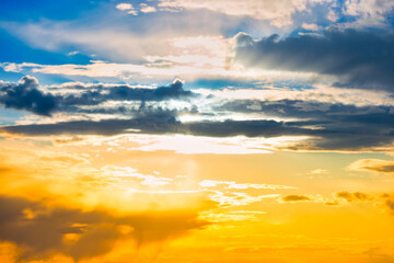 Sunset sky with blue and orange colorful sunset clouds