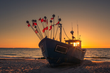 Fishing boat during sunset on the Baltic Sea in Miedzyzdroje, Zachodniopomorskie, Poland
