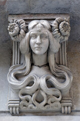 Female art deco bust on the outside wall of a Barcelona building