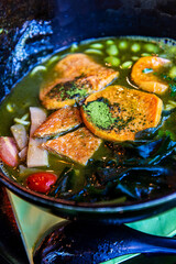 Tasty Japanese ramen soup bowl with pork, egg, and vegetables
