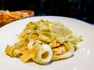 Seafood tagliatelle cream sauce and vegetables