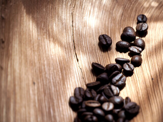 Coffee beans in a bag on wooden background , Coffee time