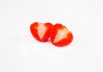 Cut into two halves strawberries isolated on a white background