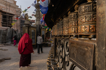 Monk walking in a Kathmandu Temple