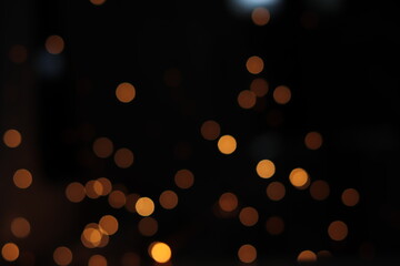 Obraz premium Gold abstract bokeh background, Festive xmas abstract background with bokeh defocused lights and stars