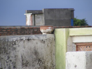 water pot for birds attached to terrace