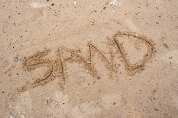 The Word Sand Written in The Sand