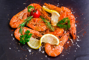 Close up  shrimp with seasoning spice and herb on black background.
