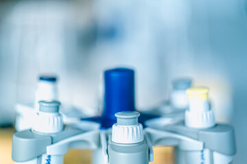 Laboratory pipettes on blurred laboratory background. Research and development concept with free...