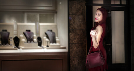 asian lady smile withholding leather bag on studio.