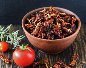 sun dried tomatoes with herbs. reserves summer vegetables for the winter. copy space
