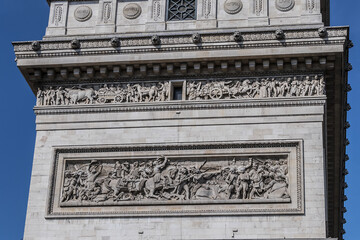 Architectural fragment of Arc de Triomphe. Arc de Triomphe de l'Etoile on Charles de Gaulle Place is one of the most famous monuments in Paris. France.