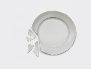 Top view of broken plate isolated on white.Studio