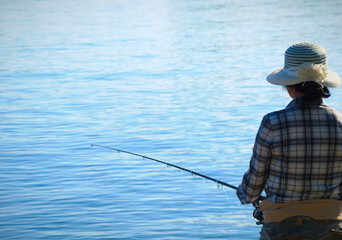 fishing woman blue lake summer water sport 