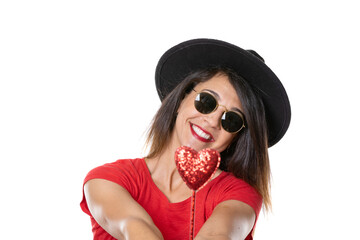 young and beautiful woman smiling and happy with black hat and sunglasses with red T-shirt and red love heart