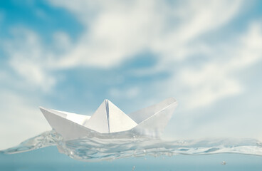 Fototapeta na wymiar Small paper boat at sea