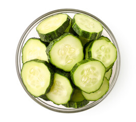 Sliced cucumber in a plate on a white background. The view from top