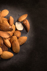 Close up of almonds on dark background.Top view