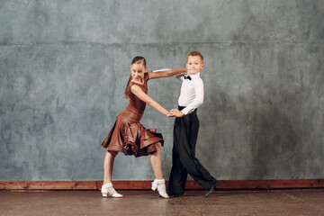 Young dancers boy and girl dancing ballroom dance Samba