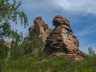 Fototapeta premium A group of people standing on a rocky hill. High quality photo