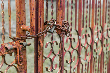 Rust fence with rust chain locked