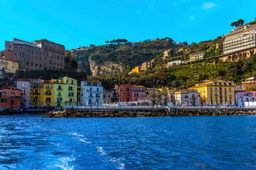 A view looking towards the shore past the harbour wall of the marina Piccola, Sorrento, Italy