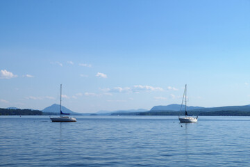 sailboats on blue lake two boats on water during summer vacation