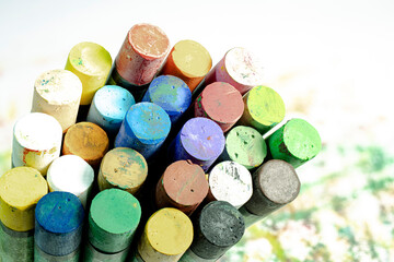 Multi-colored pastel crayons. Materials for drawing and creativity. Bright water-based paints. School supplies. Hobbies and creativity