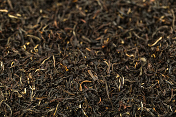 Leaves of black premium dry tea on a white background