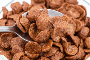 Close up: cereal chocolate on a spoon