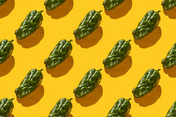Fresh green ugly bell pepper seamless trend pattern isolated on yellow background