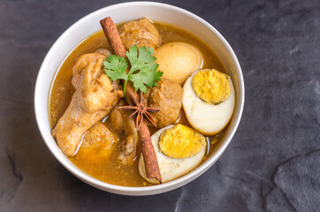 Eggs and chicken in brown sauce chicken stewed in the sweet brown Gravy,Hard boiled egg and stewed chicken in gravy sauce,Thai Cuisine call Kai Pha Lo
