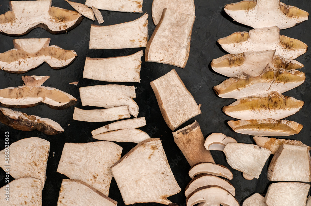 Wall mural Sliced fresh boletus edulis mushrooms prepared for drying