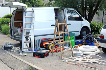 Air conditioning equipment and tools on the street during cleaning the van.